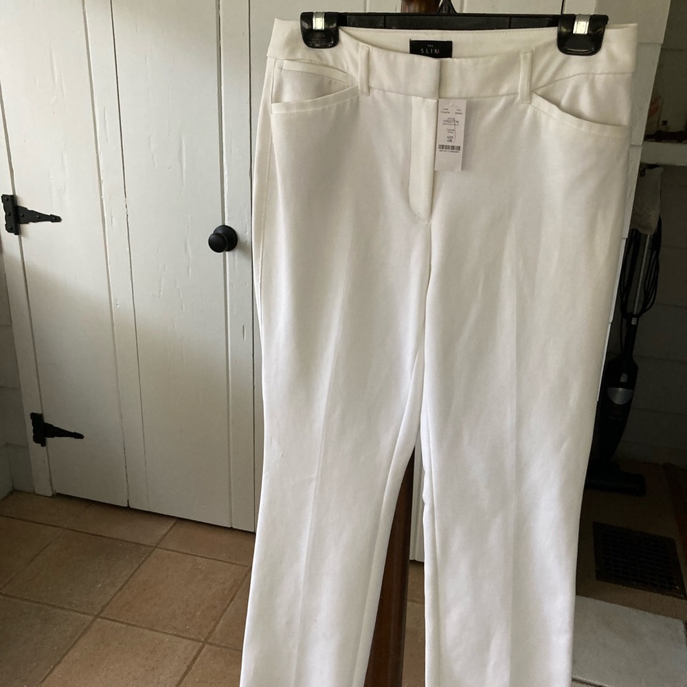 White dress pants, sits a waist
